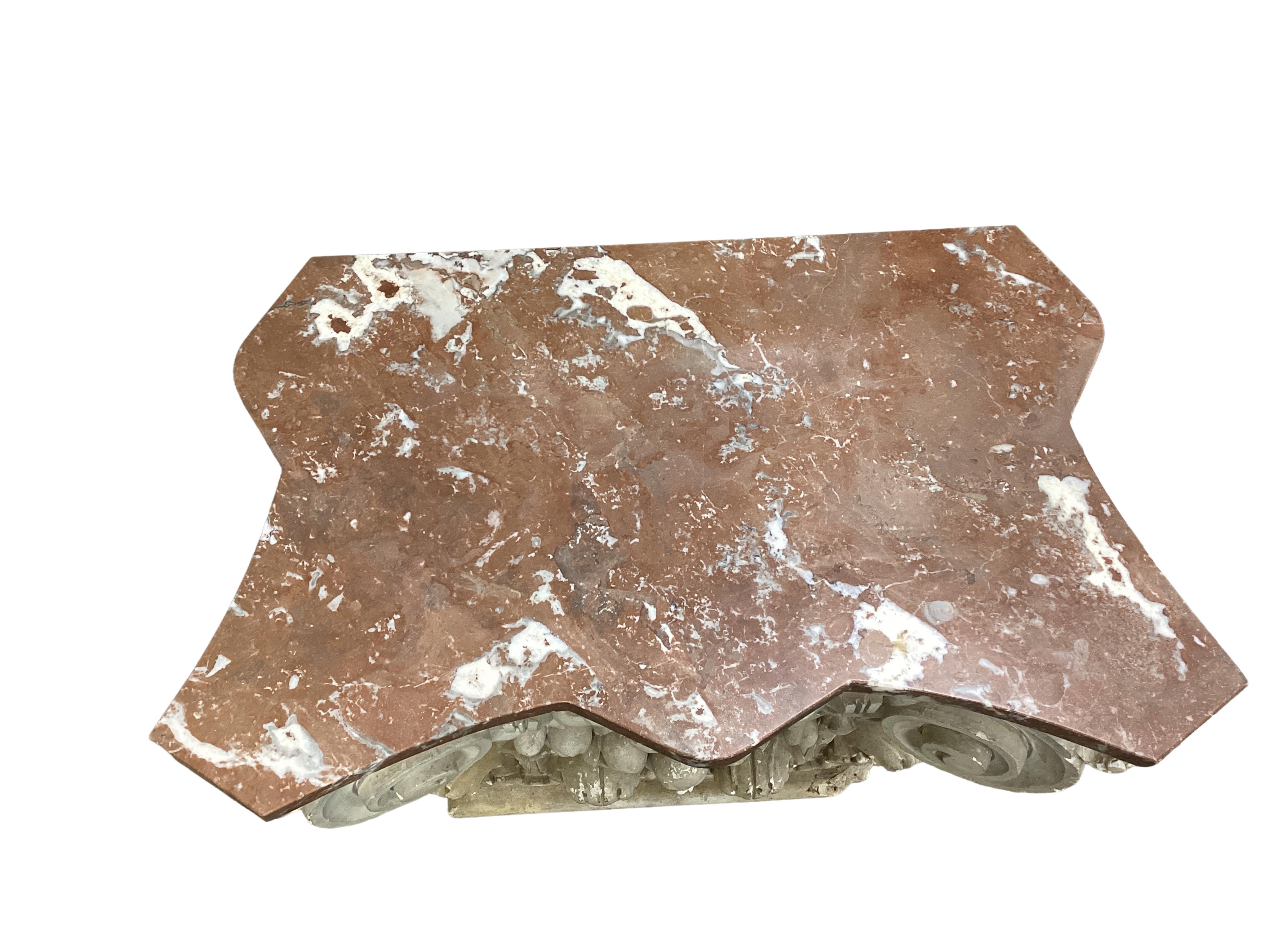 A marble topped white painted composition Ionic capital